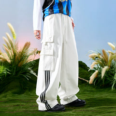 Nuthink American retro sports casual pants with wide legs and multiple pockets, spliced pants with three stripes for men, spring 2026